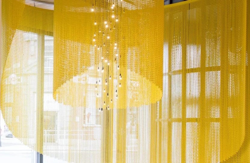 Gold metal curtain installation